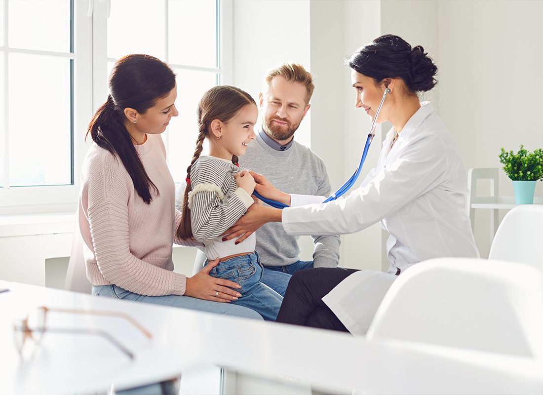 Insurance Solutions - Happy Family on a Visit to the Doctor’s Office